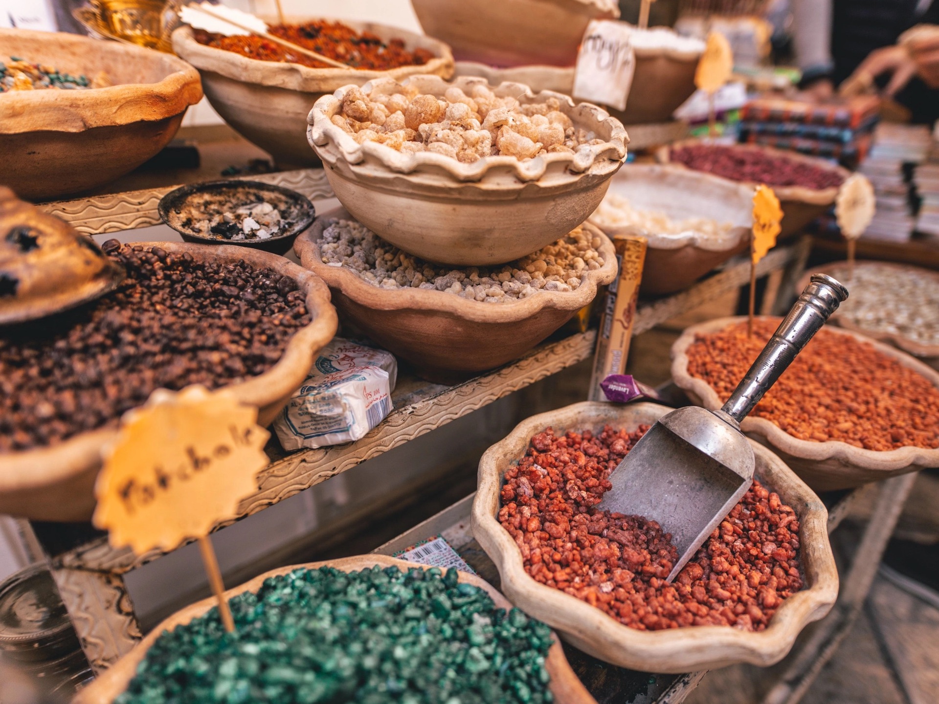 Bowls of frankincense, cloves and coloured spices on a market stall in Stone Town, Zanzibar